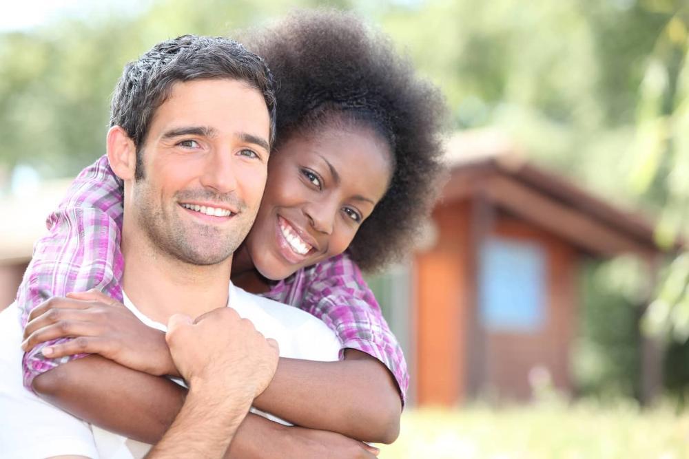 Woman smiling and hugging man in barrie