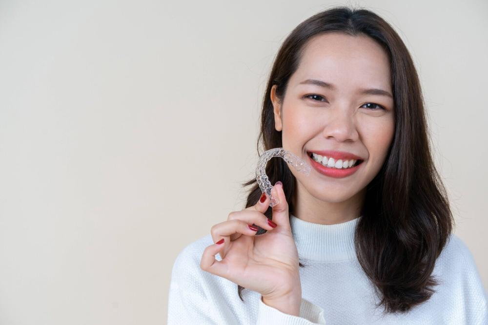 woman holding invisalign near innisfil