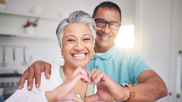 wife and husband smiling
